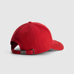 Red baseball cap on a light gray background