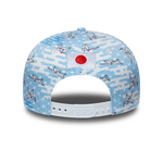 Cap with wave and crane pattern, featuring a red circle on a white background