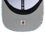 Close-up of a cap with a logo and brand name on a white background
