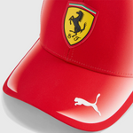Red cap with Ferrari logo on a light gray background