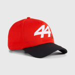 Red and black cap with a white logo on a light gray background