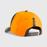 Orange and black cap with a visible brand logo on a light gray background