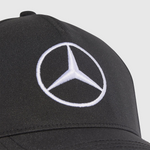 Black cap with Mercedes-Benz logo on a white background