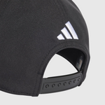 Black cap with Adidas logo on a light gray background