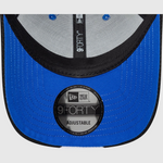 Close-up of a blue New Era 9Forty adjustable cap on a white background