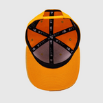 Orange cap with black and gray pattern on a white background