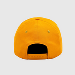 Yellow pet bed shaped like a baseball cap on a light gray background