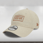A light beige 9TWENTY cap with the Oracle Red Bull Racing logo on the front and the Red Bull wordmark on the rear arch.