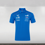 Blue polo shirt with various logos on a gray background