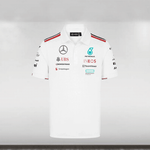 2024 Mercedes-AMG F1 Team Polo in white with sponsor and team branding, button collar, and striped tape on shoulders.