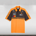 Orange and black polo shirt with various logos on a gray background