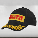 Black cap with Pirelli logo and gold laurel leaves on a light gray background