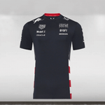 A navy-colored Red Bull Racing team t-shirt with US flag inspired design on the side panels, featuring sponsor logos and a screen-printed graphic on the back.