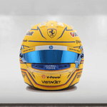 Yellow racing helmet with multiple brand logos on a white background