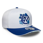 White and blue cap with embroidered design on a white background