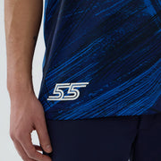 Blue athletic shirt with a white logo on a plain background