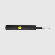 Black umbrella with a yellow logo on a light gray background