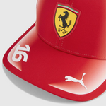 Red cap with Ferrari logo and Puma logo on a light gray background