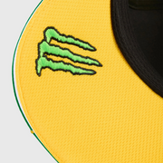 Close-up of a yellow patch with a green logo on a black background