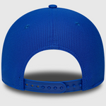 Blue mesh cap with a white interior on a light gray background