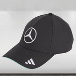 Black cap with Mercedes-Benz logo on a light gray background