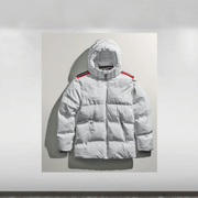 A white puffer jacket with red and black accents and branding logos displayed on a white background.