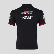 Black polo shirt with Toyota Gazoo Racing and Haas logos on a gray background