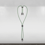 Green and black braided lanyard with metal clips on a gray background