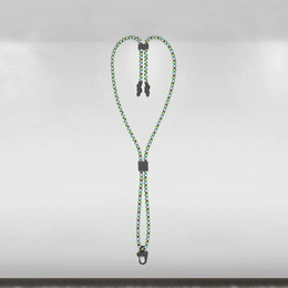 Green and black braided lanyard with metal clips on a gray background