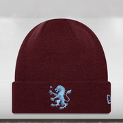 Maroon beanie with a blue embroidered lion design on a white background