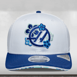 White cap with blue floral design and logo on a light gray background