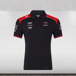 Black polo shirt with red and white accents on a gray background