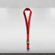 Red lanyard with 'Scuderia Ferrari' branding on a white background